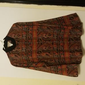 Decorative jacket with multiple patterns including paisley and floral.